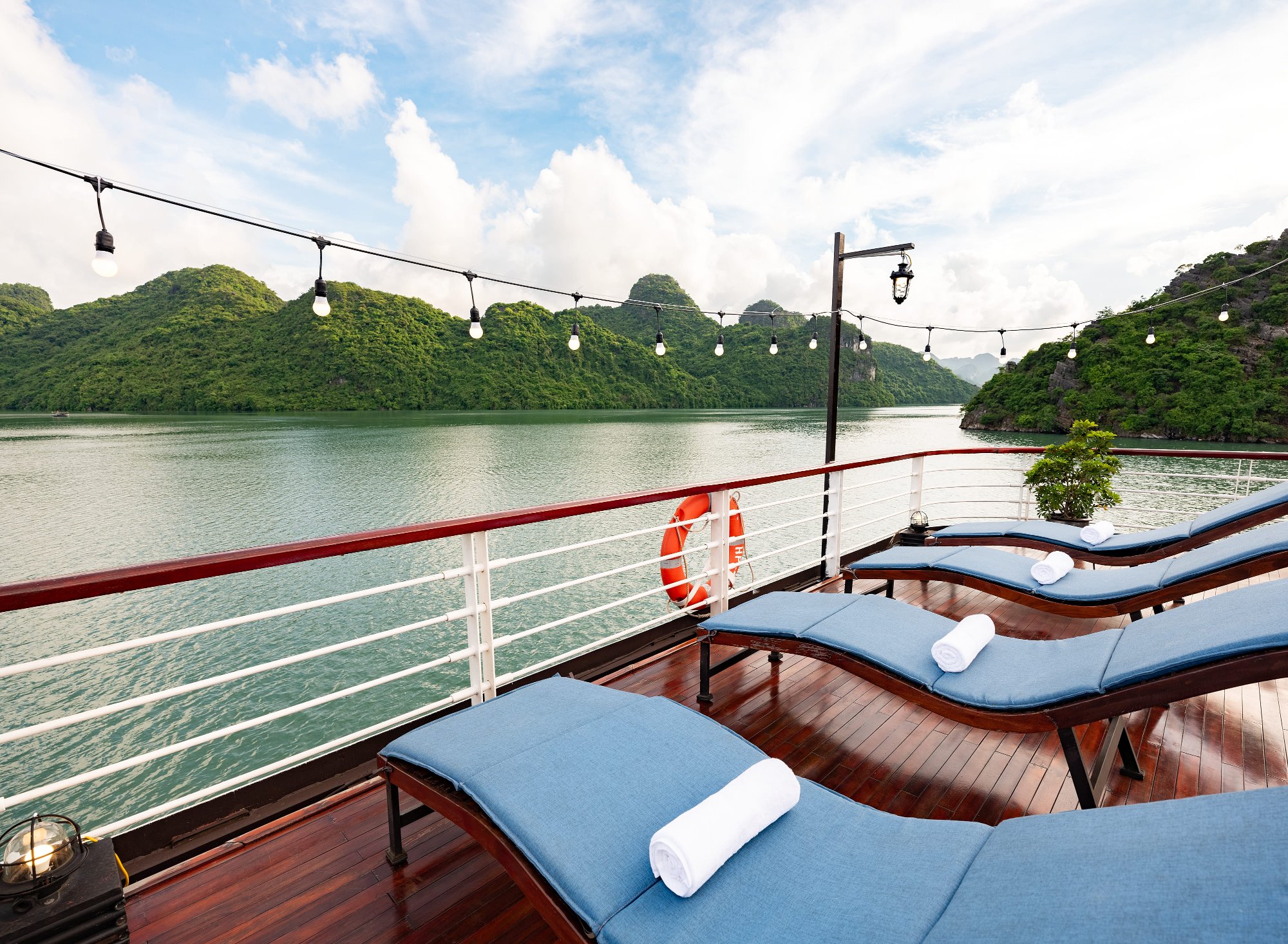 Sun loungers on the cruise deck overlooking the bay