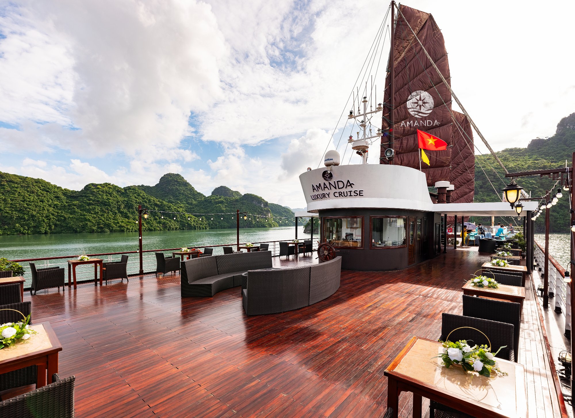 Spacious cruise deck with seating overlooking the bay