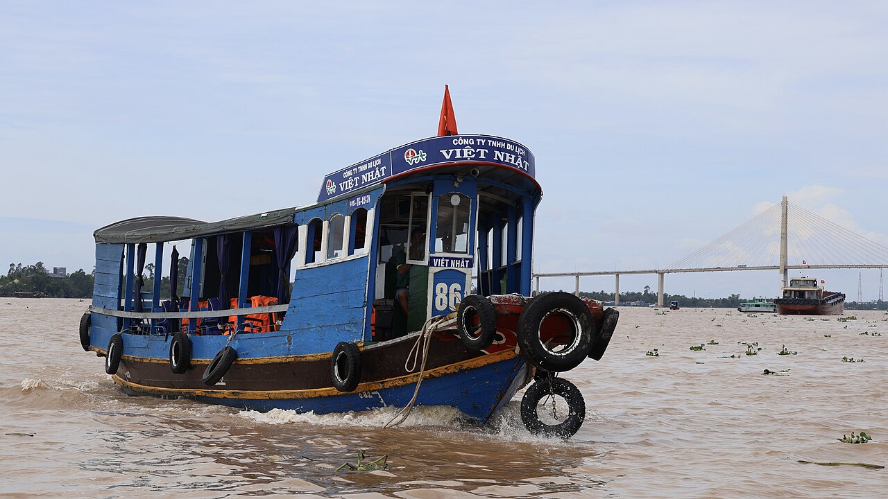 Boats on the Tien River passing through My Tho