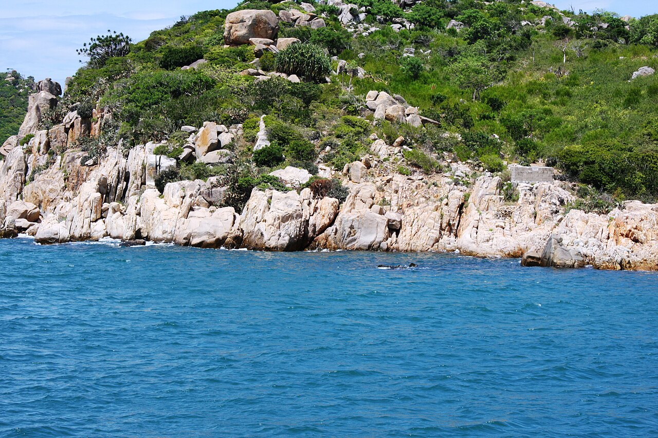 Rocky outcrops and clear blue water at Vinh Hy Bay