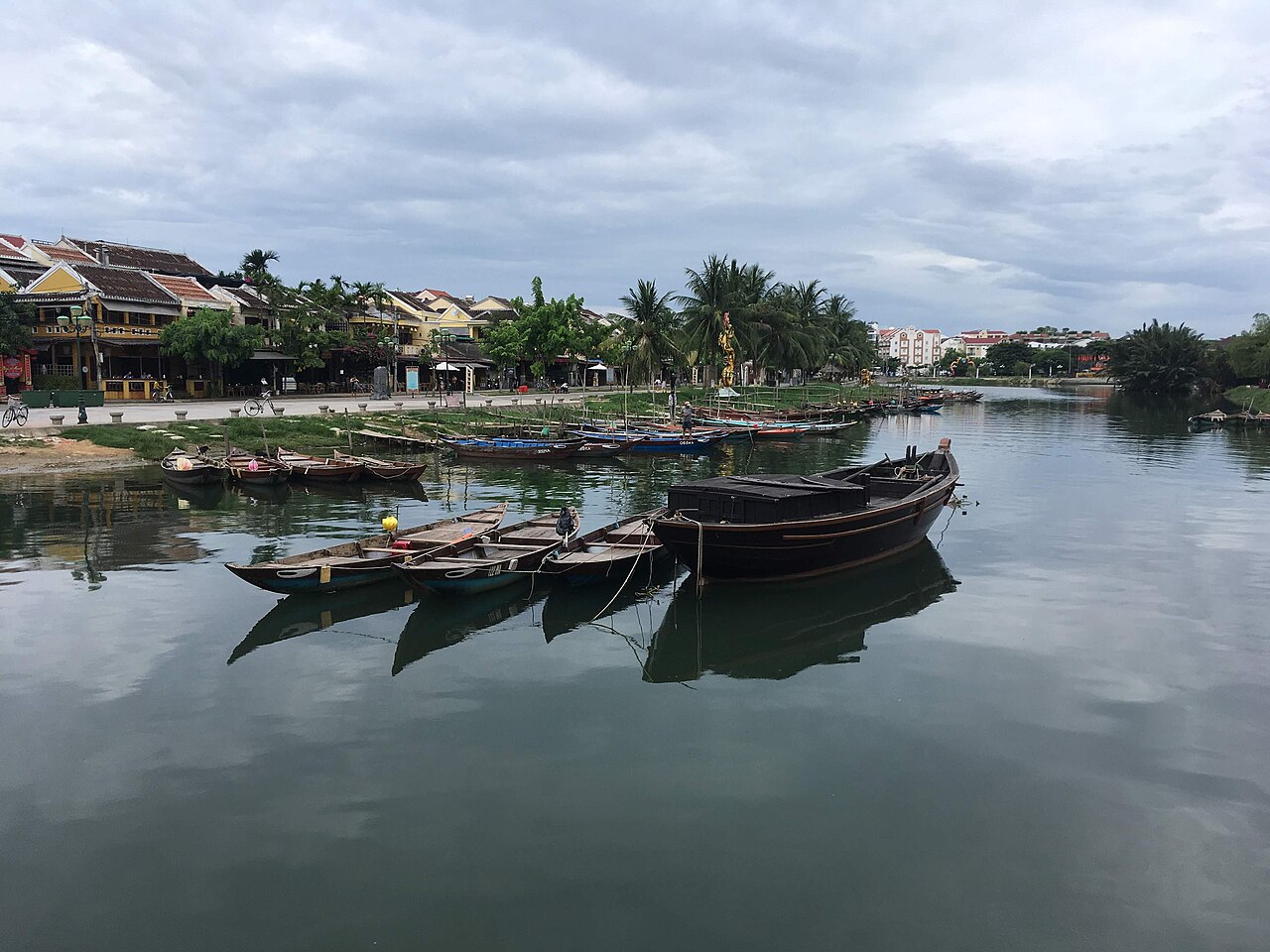Wooden boats moored on the river in Hoi An